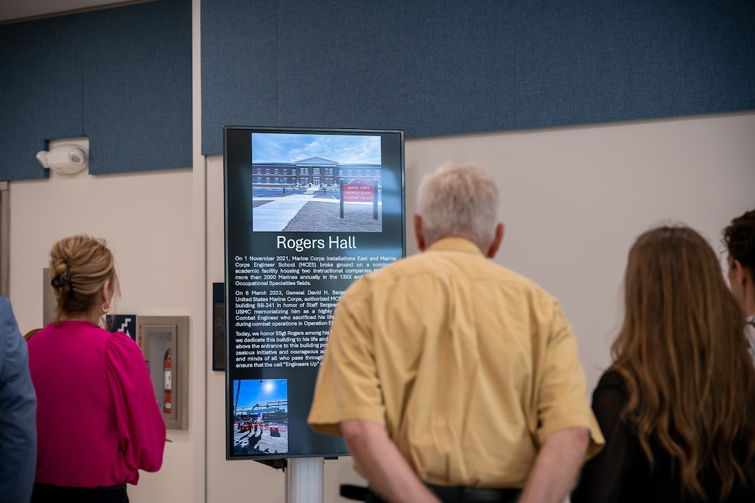 Distinguished guests tour Rogers Hall after a ribbon cutting and dedication ceremony at Marine Corps Engineer School on Marine Corps Base Camp Lejeune, North Carolina, April 4, 2025. The ceremony marked the opening of Rogers Hall, named in honor of U.S. Marine Corps Staff Sgt. Jason A. Rogers, who was killed in action during Operating Enduring Freedom. Rogers was recognized for his heroic sacrifice where he lost his life to an improvised explosive device while clearing a medical evacuation path for two of his Marines who were critically wounded. (U.S. Marine Corps photo by Cpl. Leo Amaro)