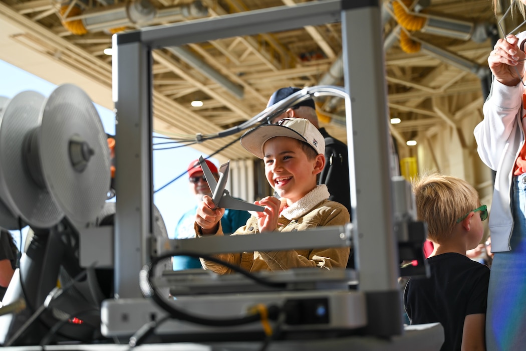 TommyDale Tierney, Navajo Public School student, assembles a 3-D printed KC-135 Stratotanker aircraft model at a Science, Technology, Engineering, and Mathematics (STEM) fair during the Altus Airpower Stampede Open House and Airshow at Altus Air Force Base, Oklahoma, April 12, 2025. The STEM fair gave children and families the opportunity to learn about different career fields through interactive activities. (U.S. Air Force photo by Senior Airman Miyah Gray)