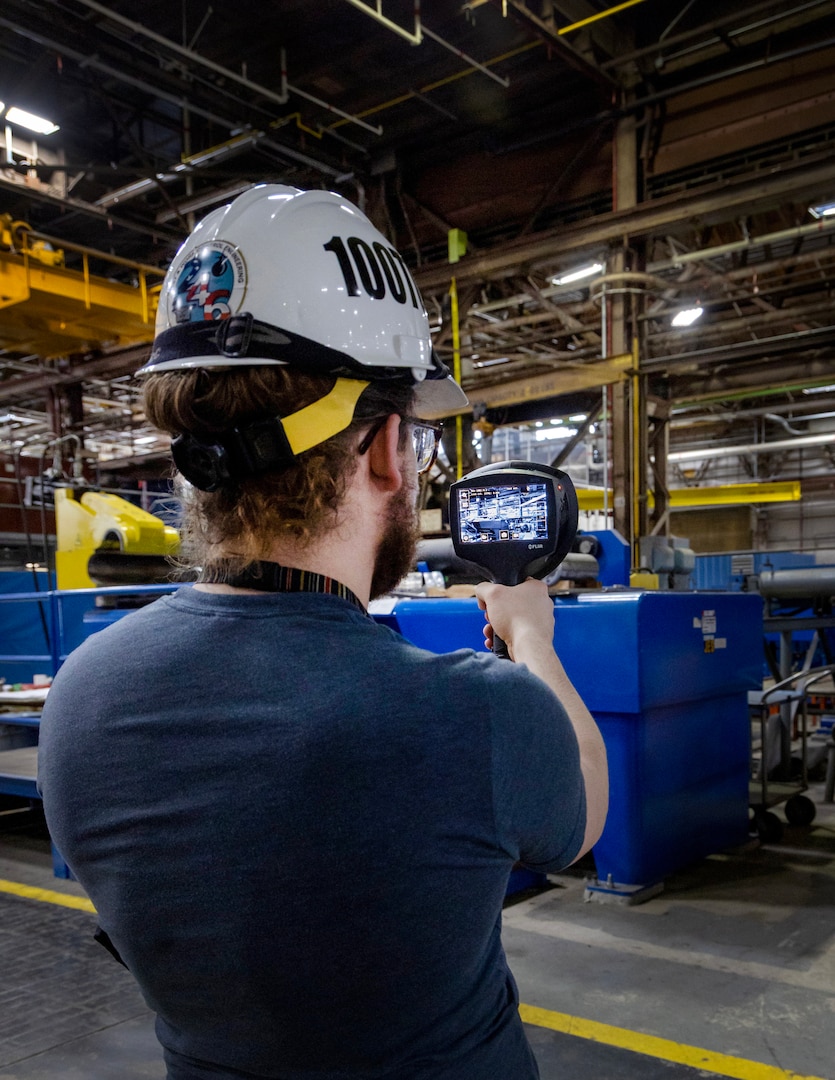 Jack Housley, project lead, Code 100TO.3, Innovation and Technology Integration, demonstrates how to use an ultrasonic leak imaging tool April 3, 2025, inside Building 460 at Puget Sound Naval Shipyard & Intermediate Maintenance Facility in Bremerton, Washington. (U.S. Navy photo by Wendy Hallmark)