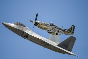 A U.S. Air Force F-22 Raptor performs a heritage flight alongside a P-51 Mustang for the Altus Airpower Stampede Open House and Air Show at Altus Air Force Base, Oklahoma, April 12, 2025. Heritage flights connect the Air Force’s past and present and honor the sacrifices of those who have served while celebrating the evolution of air power. (U.S. Air Force photo by Airman 1st Class Nathan Langston)