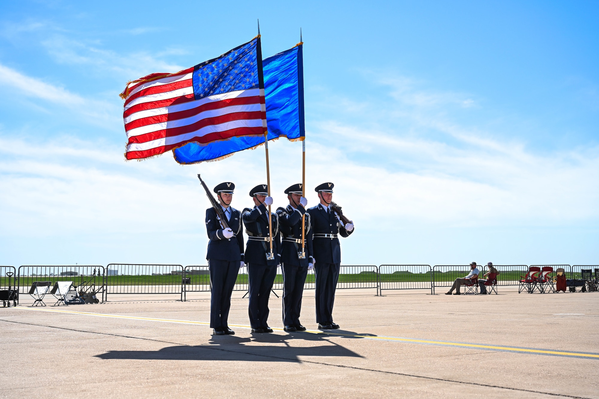 Altus Air Force Base (AFB) Blue Knights Honor Guard members stand in formation prior to the National Anthem at Altus AFB, Oklahoma, April 13, 2025. The honor guard presented the colors while the U.S. flag was also presented by a U.S. Air Force Academy Wings of Blue parachute team. (U.S. Air Force Airman 1st Class Lauren Torres)