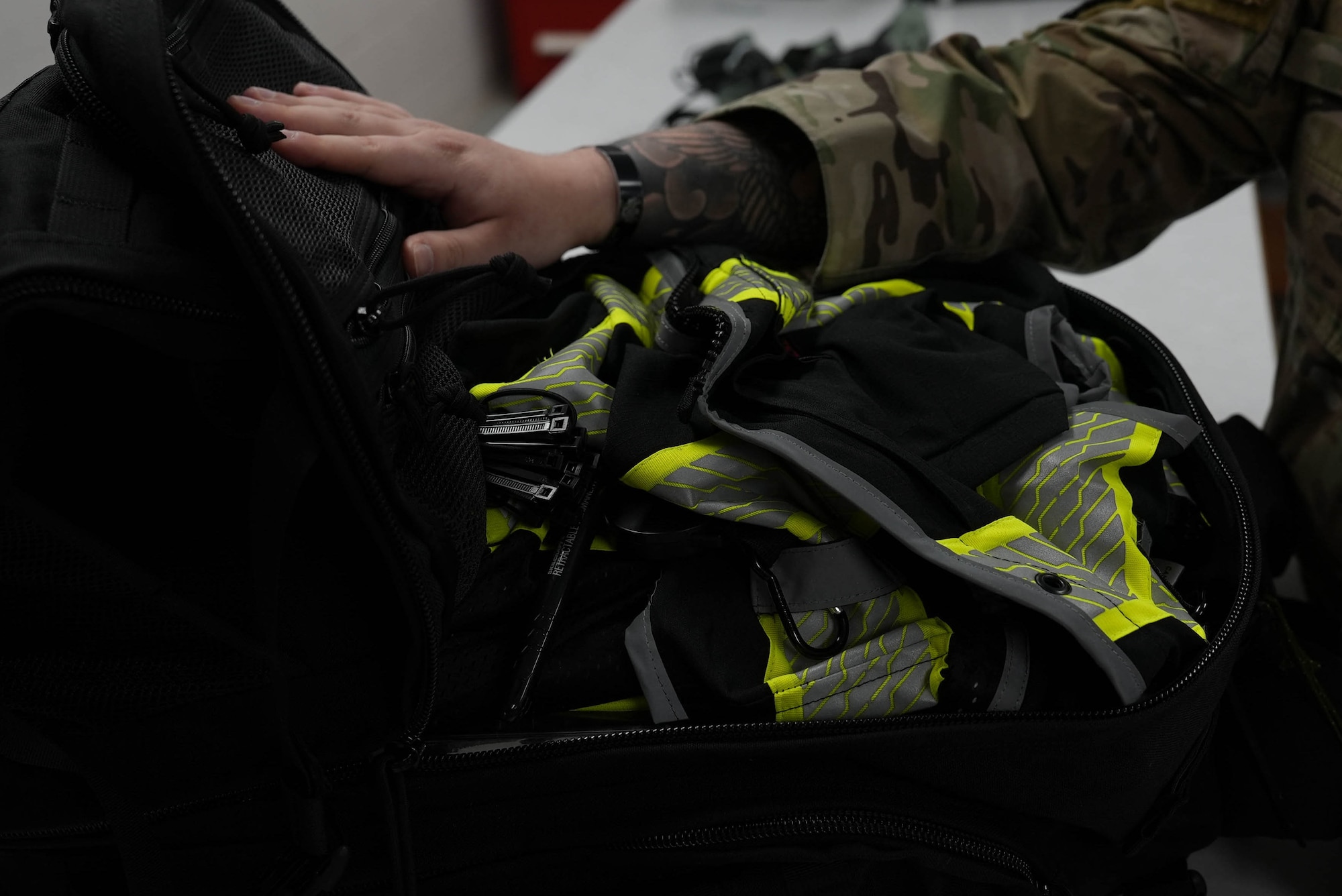 An aircrew flight equipment specialist inspects a Forward Operating Base dispersal kit at Cannon Air Force Base, New Mexico, March 17, 2025. Aircrew flight equipment specialists are responsible for the flight and safety equipment used by aircrew members. (U.S. Air Force photo Staff Sgt. Kevin Williams)