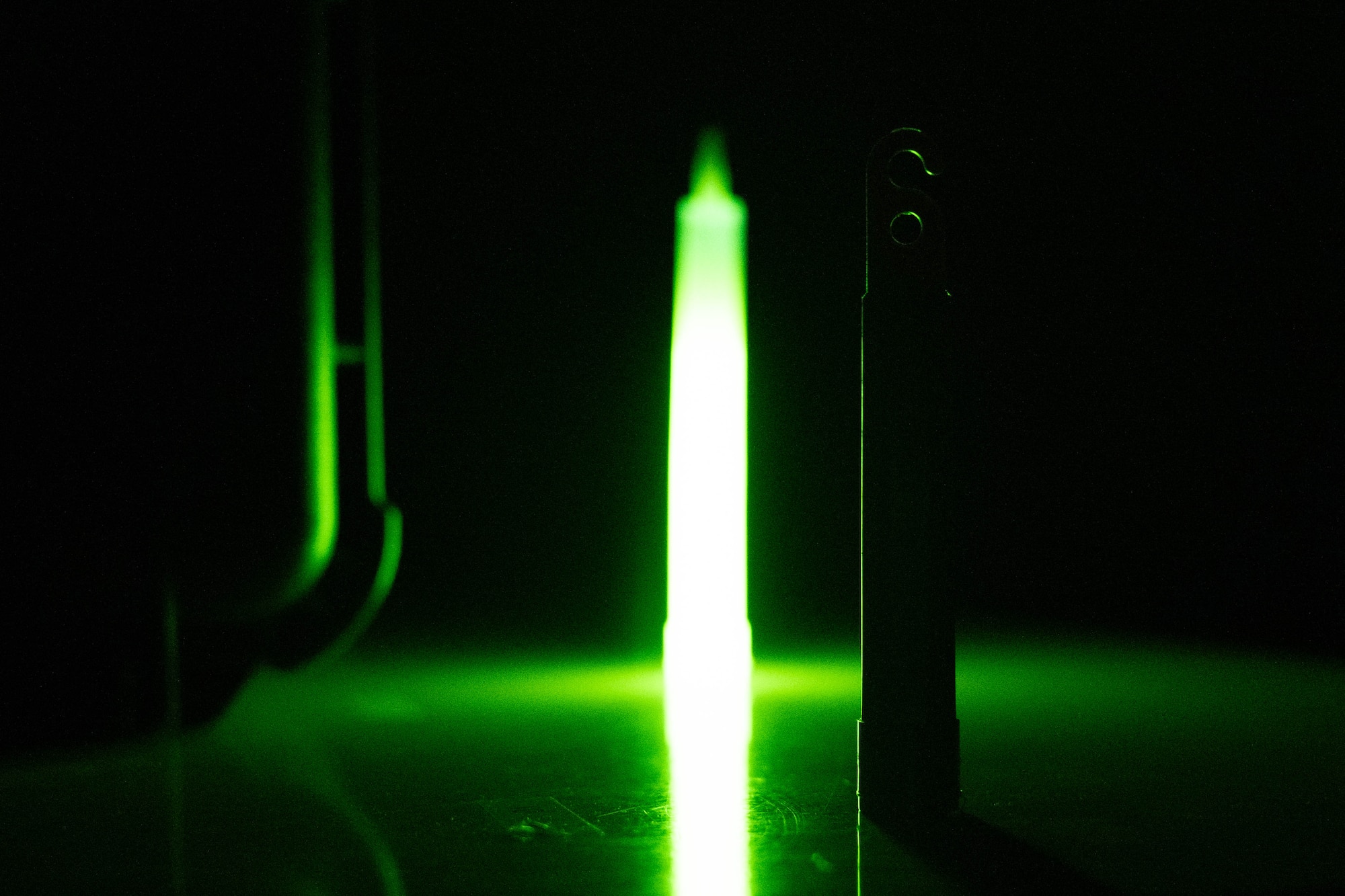 An ultraviolet and standard glow stick are displayed side-by-side