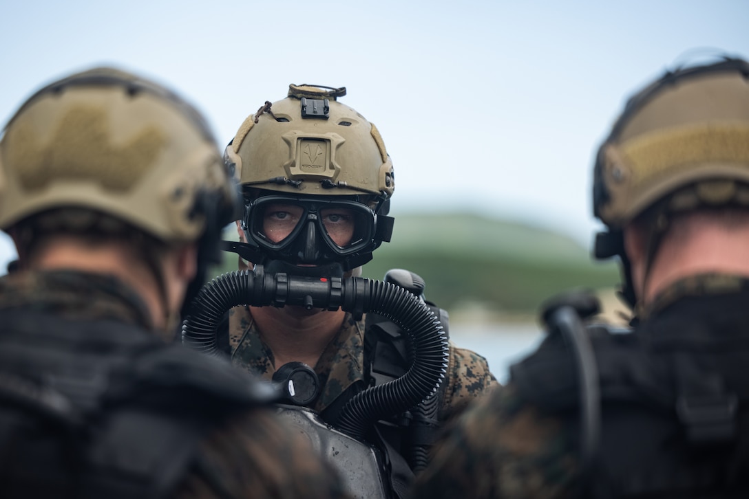 A U.S. Marine with 1st Reconnaissance Battalion, 1st Marine Division, conducts dive operations on Marine Corps Base Hawaii Feb. 24, 2025. 1st Reconnaissance Battalion conducted the training to enhance rapid insertion capabilities in littoral zones as preparation for integrating with 3d Marine Littoral Regiment and its subordinate battalions while forward in the Philippines for Exercise Balikatan 25 and Kamandag 9 this summer. (U.S. Marine Corps photo by Cpl. Malia Sparks)