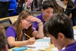 Students work together to solve stimulating math equations in hopes of taking home the team award at the Carderock Math Contest (CMC), held at Naval Surface Warfare Center, Carderock Division on April 4, 2025 in West Bethesda, Md.