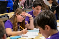 Students work together to solve stimulating math equations in hopes of taking home the team award at the Carderock Math Contest (CMC), held at Naval Surface Warfare Center, Carderock Division on April 4, 2025 in West Bethesda, Md.