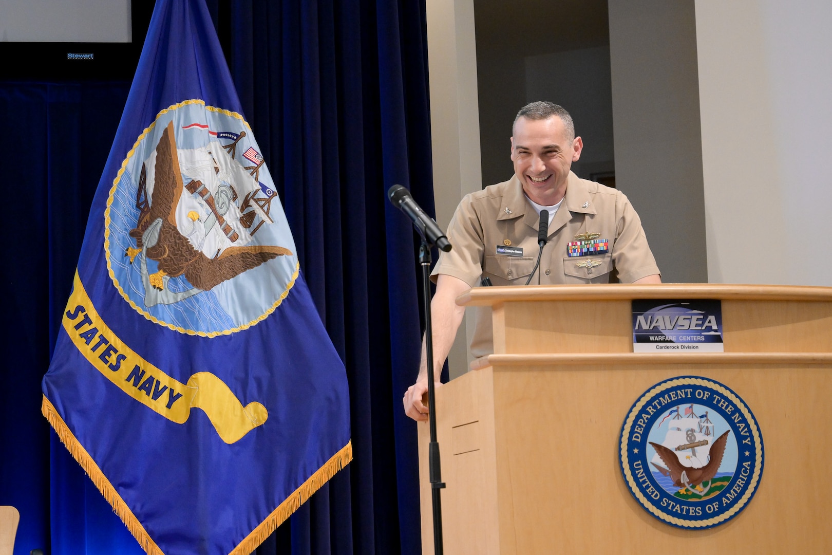 Naval Surface Warfare Center, Carderock Division’s Commanding Officer Capt. Chris Matassa shares encouraging words with an audience of over 180 excited middle schoolers at the annual Carderock Math Contest (CMC) on Friday April 4, 2025 at Naval Surface Warfare Center, Carderock Division in West Bethesda, Md.