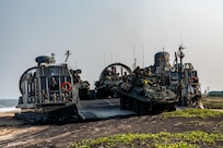 U.S. Marines assigned to 1st Light Armored Reconnaissance Battalion, 1st Marine Division, prepare to disembark an Assault Craft Unit (ACU) 5 Landing Craft Air Cushion (LCAC) launched from the Whidbey Island-class dock landing ship USS Comstock (LSD 45) in Light Armored Vehicles (LAV-25)  during a large-scale amphibious landing drill held as part of Exercise Tiger Triumph 2025, at Kakinada Beach, Andhra Pradesh, India, April 11.