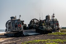 U.S. Marines assigned to 1st Light Armored Reconnaissance Battalion, 1st Marine Division, prepare to disembark an Assault Craft Unit (ACU) 5 Landing Craft Air Cushion (LCAC) launched from the Whidbey Island-class dock landing ship USS Comstock (LSD 45) in Light Armored Vehicles (LAV-25)  during a large-scale amphibious landing drill held as part of Exercise Tiger Triumph 2025, at Kakinada Beach, Andhra Pradesh, India, April 11.