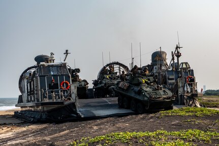 U.S. Marines assigned to 1st Light Armored Reconnaissance Battalion, 1st Marine Division, prepare to disembark an Assault Craft Unit (ACU) 5 Landing Craft Air Cushion (LCAC) launched from the Whidbey Island-class dock landing ship USS Comstock (LSD 45) in Light Armored Vehicles (LAV-25)  during a large-scale amphibious landing drill held as part of Exercise Tiger Triumph 2025, at Kakinada Beach, Andhra Pradesh, India, April 11.