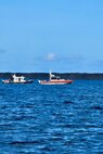 Maritime law enforcement and emergency responders from the Guam Port Authority and Guam Fire Department conduct training in Apra Harbor, Guam, as part of the NASBLA Boat Crew Member Course on March 27, 2025.