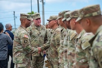 U.S. Army Pacific Commander Gen. Ronald Clark meets with Soldiers from B Company, 1st Battalion, 294th Infantry Regiment of the Guam Army National Guard, or Team Binadu, following a unit awards ceremony recognizing the team winning the Alexander Hamilton Award at Guam National Guard Barrigada Readiness Center, April 12.