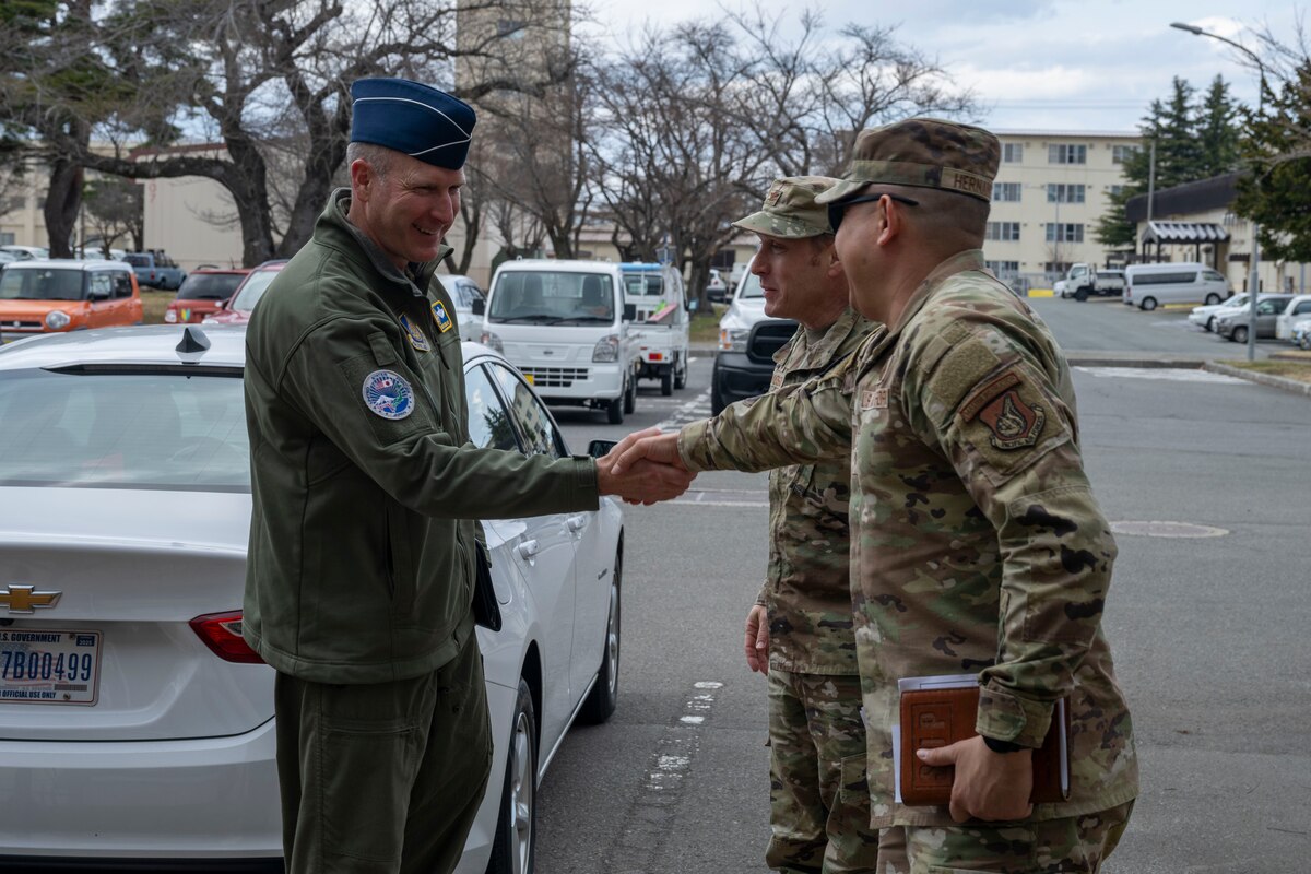 U.S. Air Force Lt. Gen. Stephen Jost, left, U.S. Forces Japan and Fifth Air Force commander, is greeted by Col. Paul Davidson, center, 35th Fighter Wing (FW) commander, and Chief Master Sgt. David Najera, 35th FW command chief, for a mentorship briefing