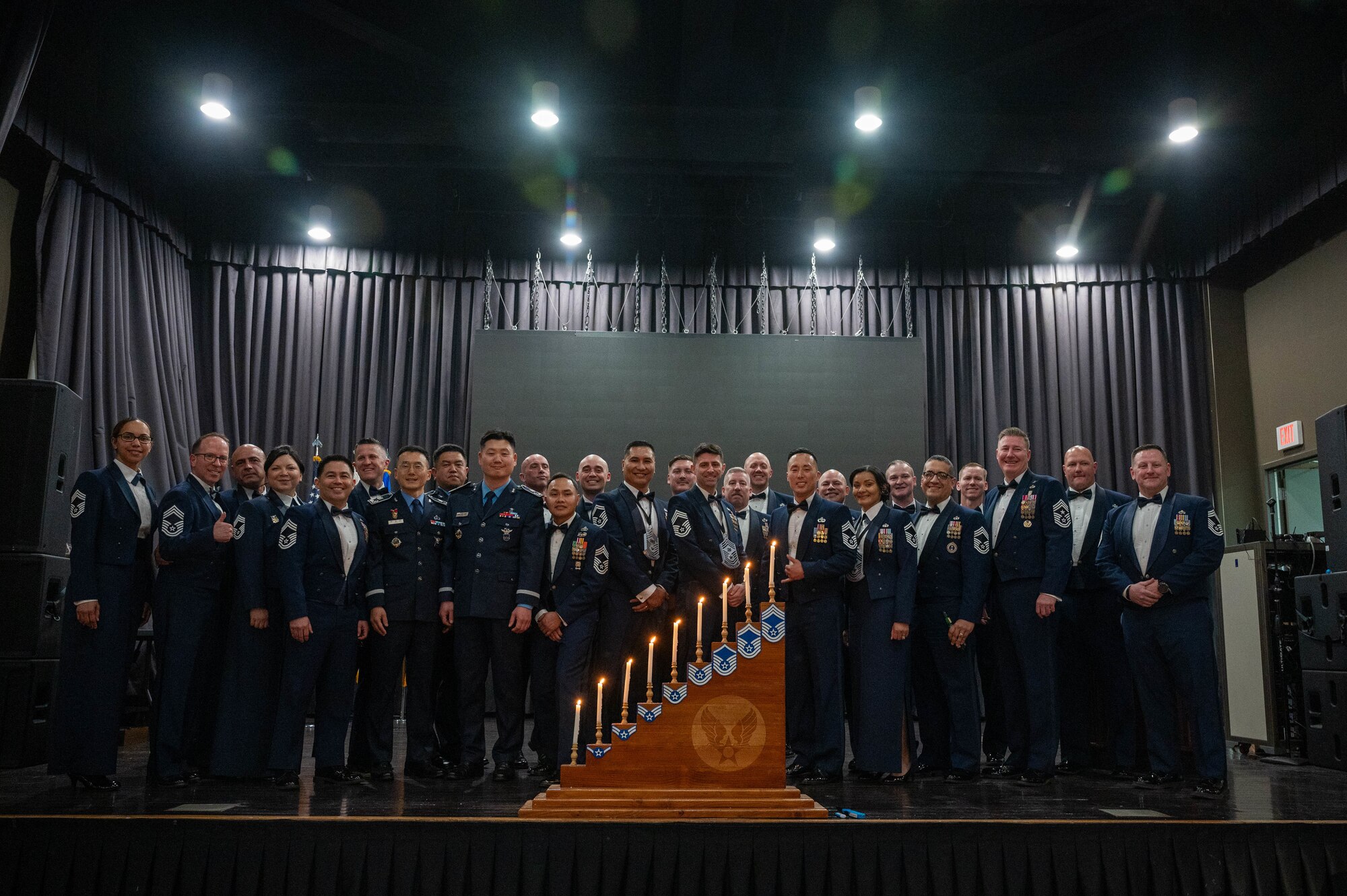 U.S. Air Force chief master sergeants and newly selected chiefs pose for a photo during the 2025 Chief Recognition Ceremony at Osan Air Base, Republic of Korea, April 11, 2025. During the ceremony, four Airmen accepted the rank of chief master sergeant, the highest enlisted rank in the Air Force. (U.S. Air Force photo by Staff Sgt. Christopher Tam)