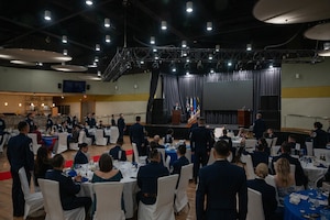 U.S. Air Force chief master sergeants stand and repeat the Chief Master Sergeant oath alongside newly selected chiefs during the 2025 Chief Recognition Ceremony at Osan Air Base, Republic of Korea, April 11, 2025. Those recognized were joined by family, friends and fellow chiefs to honor and recognize their dedication and progression through the ranks. (U.S. Air Force photo by Staff Sgt. Christopher Tam)