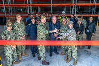 NAVAL SUPPORT ACTIVITY SOUDA BAY, Greece (April 3, 2025) Personnel assigned to Naval Facilities Engineering Systems Command, Navy Region Europe, Africa, Central, Public Works Department; Naval Support Activity (NSA) Souda Bay; and Naval Supply Systems Command Fleet Logistics Center Sigonella, Site Souda Bay, participate in a ribbon cutting ceremony for the P144 Marathi Logistics Support Center at the NATO Marathi Pier Complex, Souda Bay, Greece, on April 3, 2025. NSA Souda Bay is an operational ashore installation that enables and supports U.S., Allied, Coalition, and partner nation forces to preserve security and stability in the European, African, and Central Command areas of responsibility. (U.S. Navy photo by Mass Communication Specialist 2nd Class Andrew Eder)