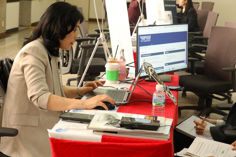 Contracting specialists at an event with local Korean businesses.