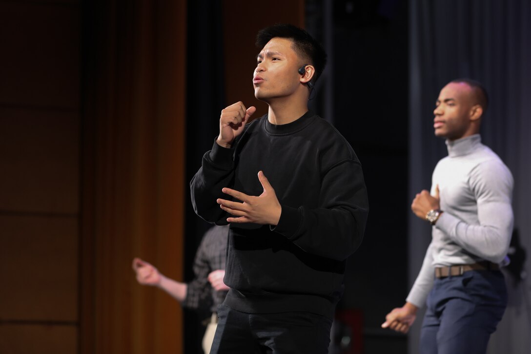 Singer rehearsing on stage for performance