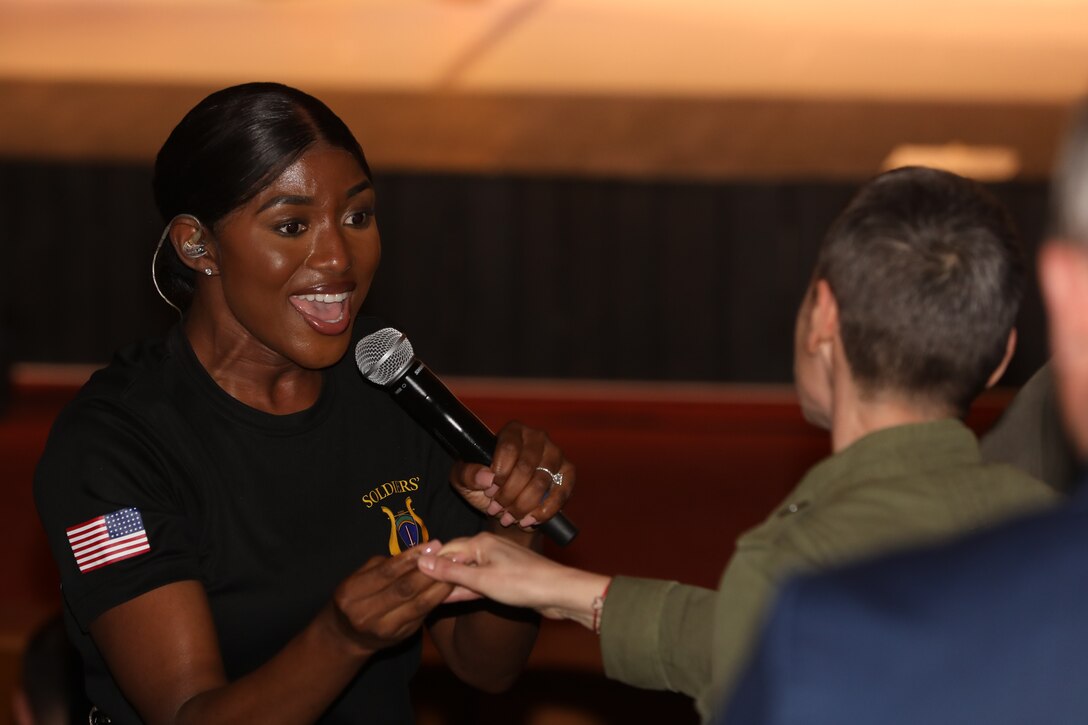Singer singing to audience member