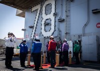 The Secretary of the Navy, the Hon. John C. Phelan, is piped ashore aboard the world’s largest aircraft carrier, USS Gerald R. Ford (CVN 78), during a scheduled visit, April 11, 2025.