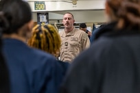 Lt. Cmdr. Corey Sommer, 1st lieutenant aboard the world’s largest aircraft carrier, USS Gerald R. Ford (CVN 78), speaks to Sailors assigned to deck department in the fo’c’sle, March 17, 2025.