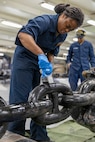 Boatswain’s Mate Seaman Diamond Cropper, assigned to deck department aboard the world’s largest aircraft carrier, USS Gerald R. Ford (CVN 78), paints an anchor chain in the fo’c’sle, March 17, 2025.