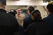 Lt. Cmdr. Corey Sommer, 1st lieutenant aboard the world's largest aircraft carrier, USS Gerald R. Ford (CVN 78), briefs deck department Sailors in the foc'sle, March 17, 2025.