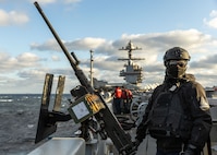 Aviation Ordnanceman Airman Elijah Partlow, assigned to weapons department aboard the world’s largest aircraft carrier, USS Gerald R. Ford (CVN 78), mans an M2 Browning machine gun on the catwalks during a live-fire exercise, March 18, 2025.