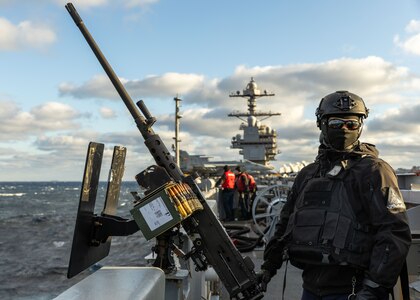 Aviation Ordnanceman Airman Elijah Partlow, assigned to weapons department aboard the world’s largest aircraft carrier, USS Gerald R. Ford (CVN 78), mans an M2 Browning machine gun on the catwalks during a live-fire exercise, March 18, 2025.