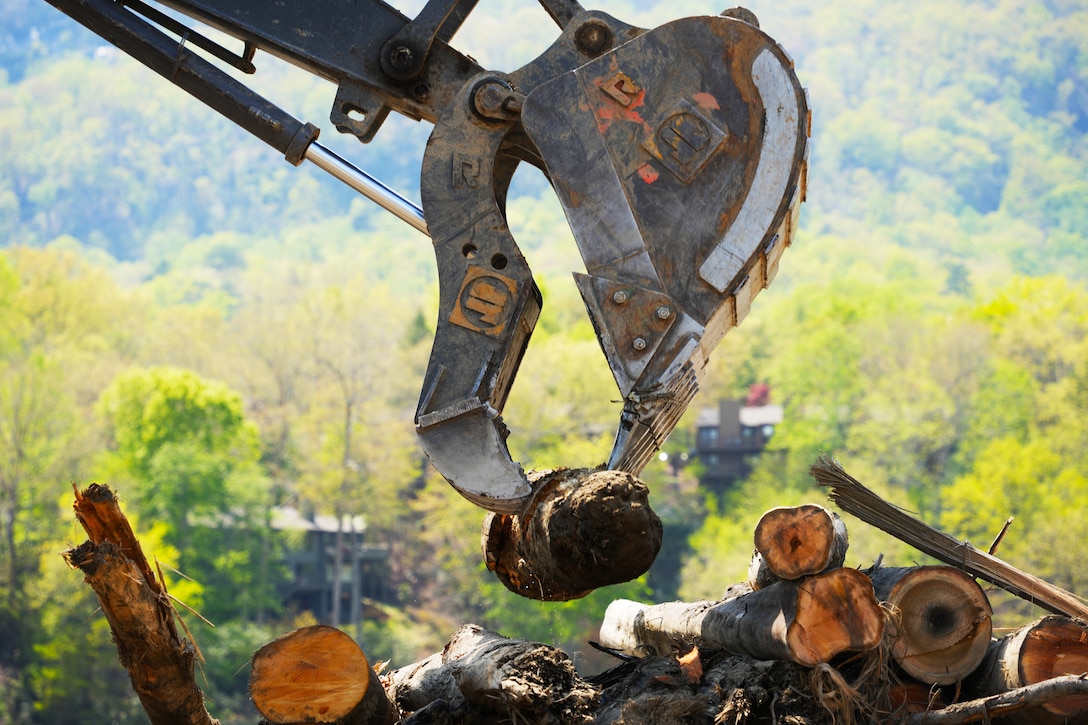 U.S. Army Corps of Engineers contractors sort debris pulled from the bottom of Lake Lure in Rutherford County, North Carolina on April 14, 2025. Vegetative and man-made debris was washed into Lake Lure after Hurricane Helene devastated the region.