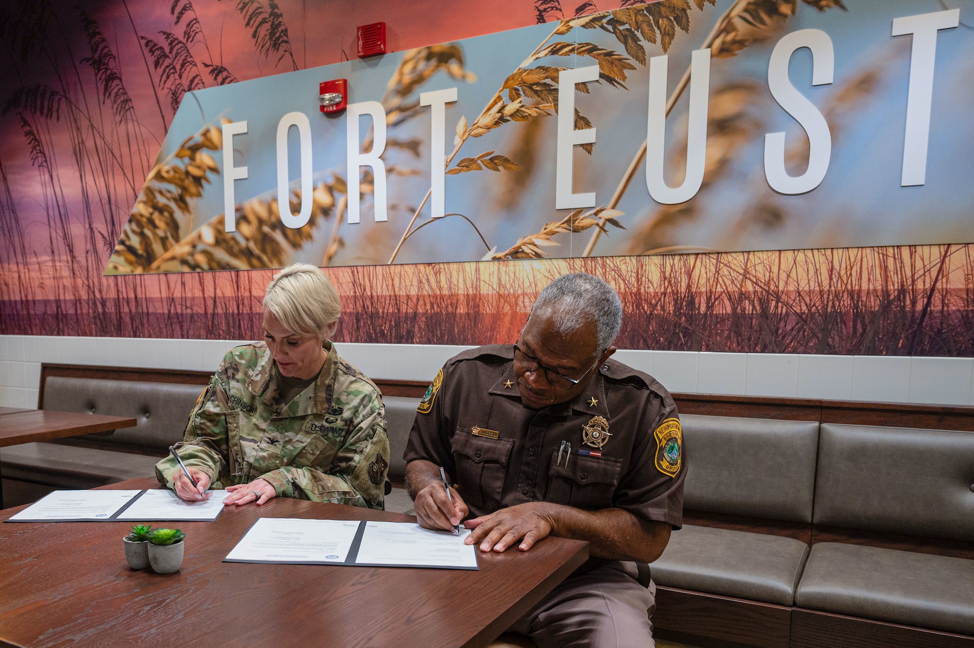 Leaders sign an MOU.