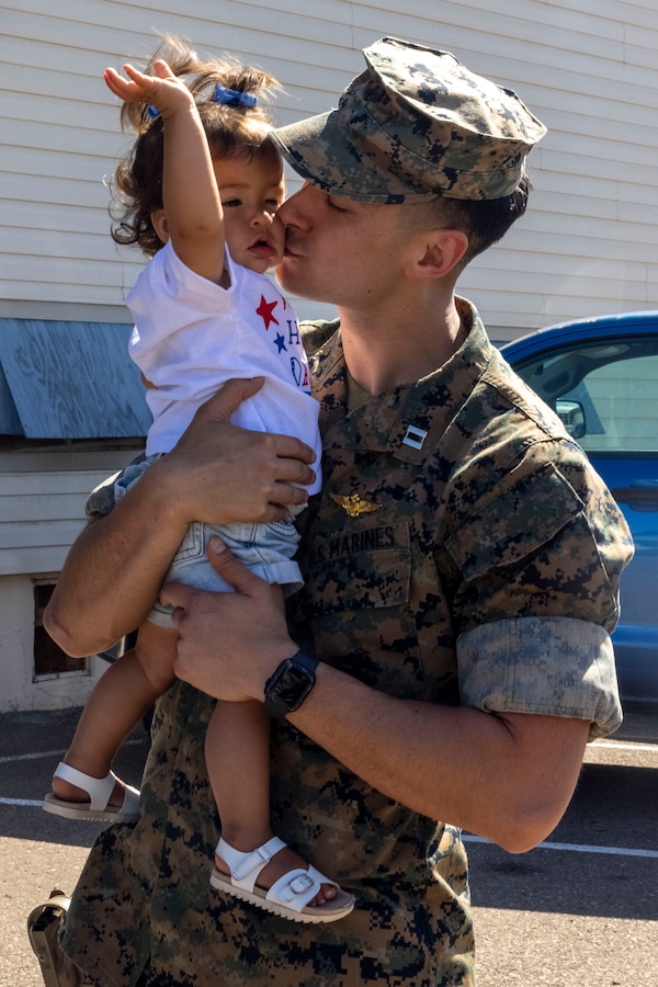 U.S. Marine Corps Capt. Tyler Alcid, a CH-53E Super Stallion pilot with Marine Heavy Helicopter Squadron (HMH) 465, Marine Aircraft Group 16, 3rd Marine Aircraft Wing, celebrates with his daughter after returning home to Marine Corps Air Station Miramar, California, April 9, 2025. HMH-465 and Marine Aviation Logistics Squadron 16, MAG-16, completed a six-month deployment to the Indo-Pacific region, supporting the Unit Deployment Program and the 31st Marine Expeditionary Unit, during which the squadrons conducted a range of operations to enhance combat readiness, deter aggression, and strengthen alliances and partnerships. Regular forward deployments like these ensure 3rd MAW squadrons remain ready to respond to crises and uphold security in the Indo-Pacific region. (U.S. Marine Corps photo by Staff Sgt. Gabriel Tavarez)