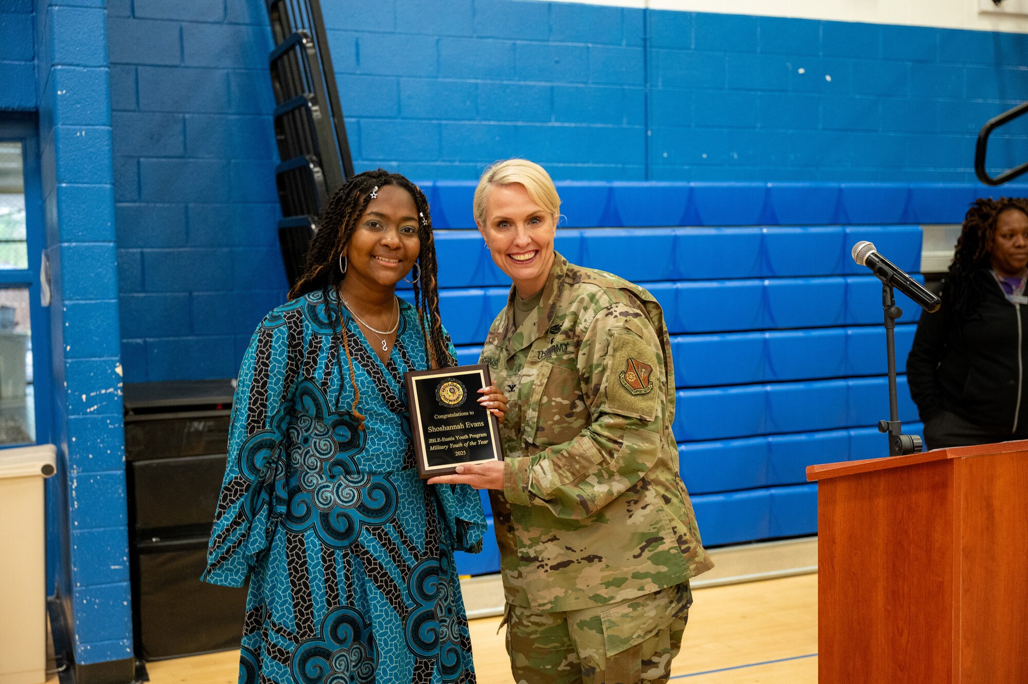 Shoshannah Evans and Col. Laura Hutchinson pose with Evans' award