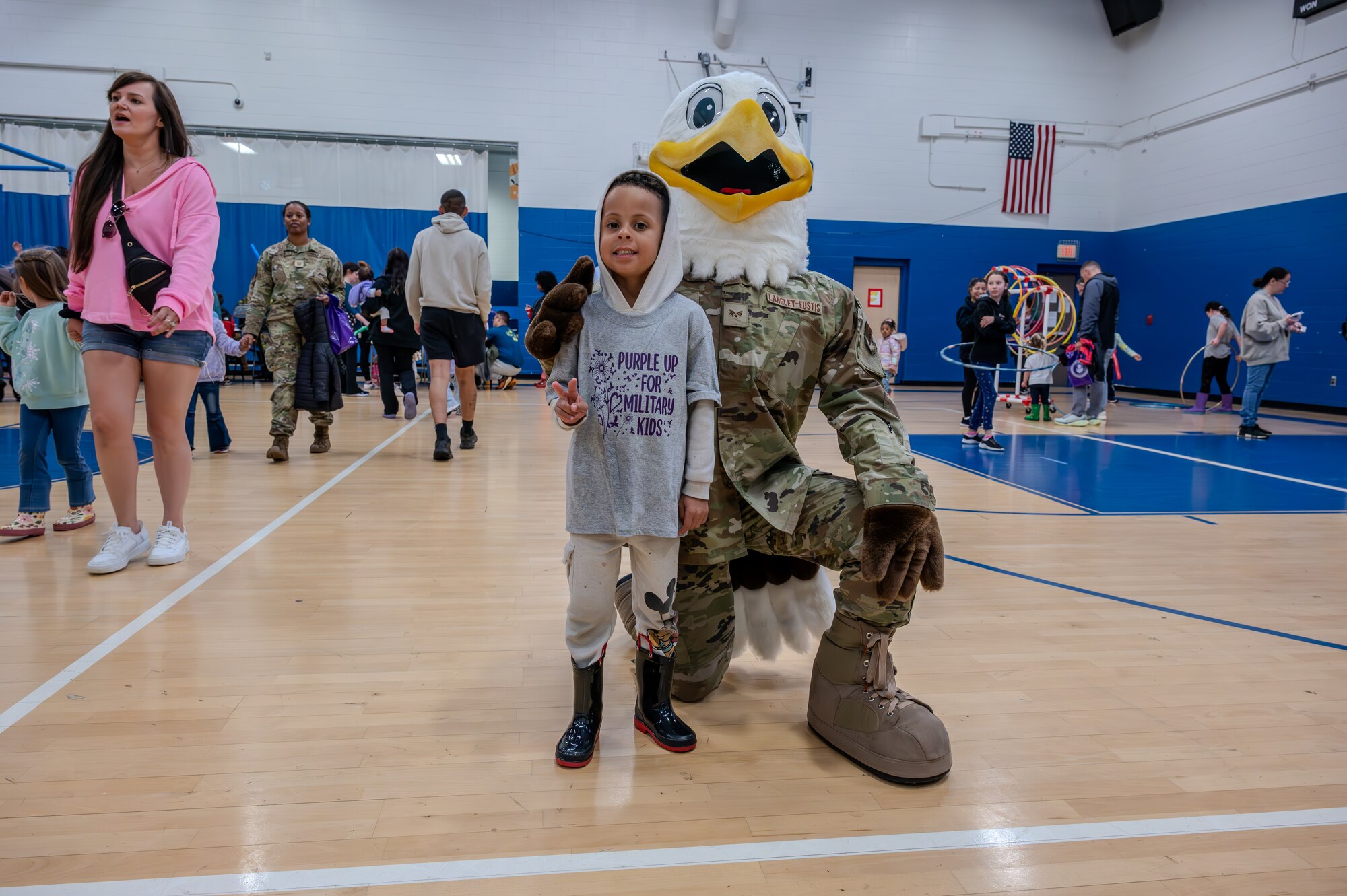 JB the Eagle, Joint Base Langley-Eustis’ mascot takes a photo with a child