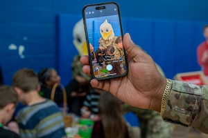 An Airman takes a photo on their phone of JB the Eagle, Joint Base Langley-Eustis’ mascot