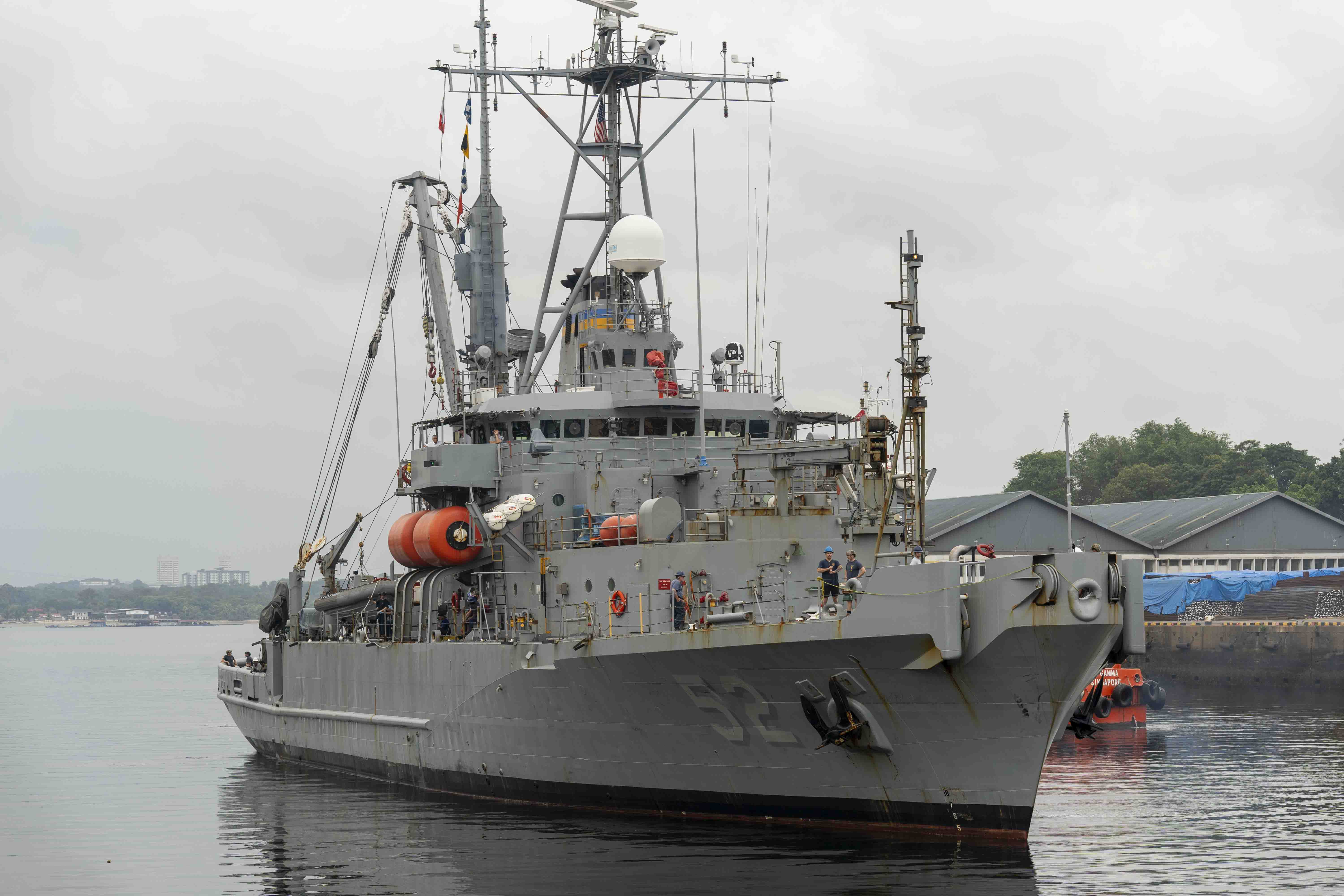 The Safeguard-class rescue and salvage ship USNS Salvor (T-ARS-52) prepares to moor pier side at Sembawang Naval Instillation (SNI) during a regularly scheduled port visit to Singapore.
