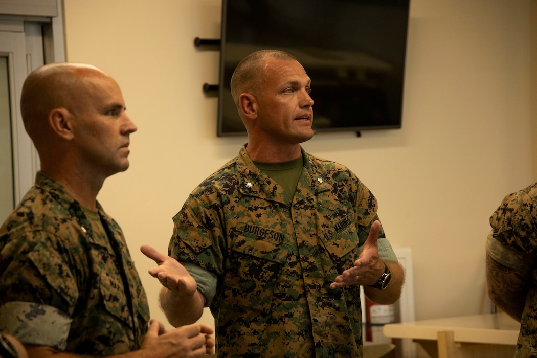 U.S. Marine Corps Lt. Col. Benjamin Burgeson, right, commanding officer of Marine Aviation Logistics Squadron (MALS) 41, Marine Aircraft Group (MAG) 41, 4th Marine Aircraft Wing (MAW) and Lt. Col. Scott Martin, commanding officer of MALS-24, MAG-24, 1st MAW give a brief at the start of exercise Fortified Warrior at Marine Corps Base Hawaii, July 10, 2024. Fortified Warrior integrated MALS-41 and MALS-49, MAG-49, 4th MAW into MALS-24 operations to bolster intermediate level aviation logistics and maintenance capabilities during a period of high operational tempo. (U.S. Marine Corps photo by Cpl. Joseph Abreu)