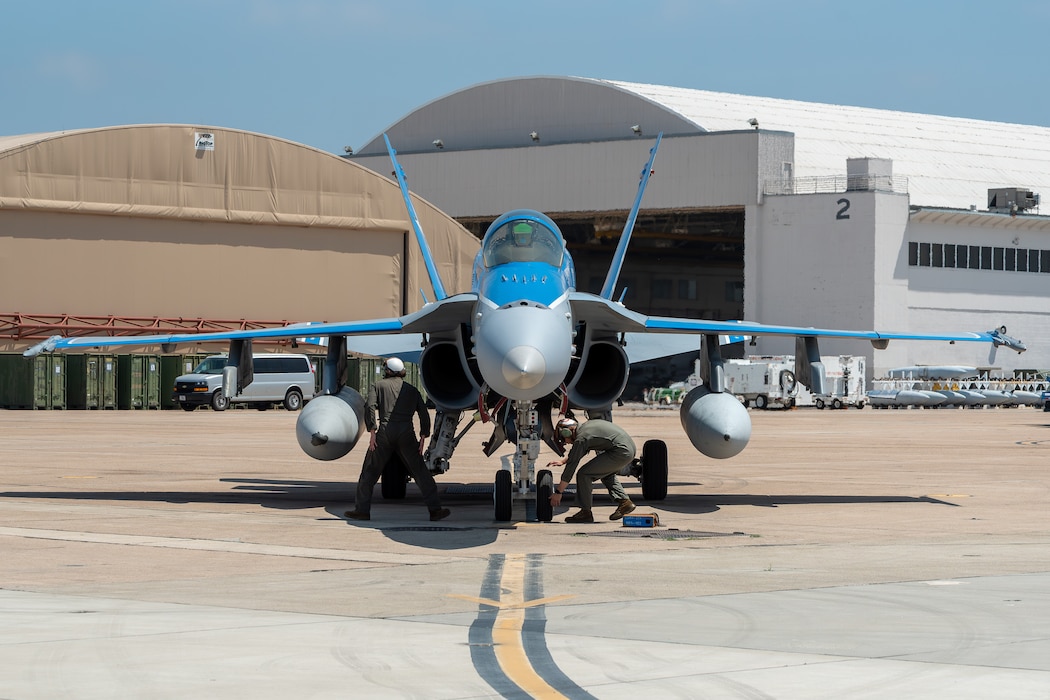 U.S. Marine Corps Cpl. Gage Henson, power line mechanic, and Cpl. Michael Roberts, fixed-wing aircraft mechanic, Marine Fighter Attack Squadron 112 (VMFA), Marine Aircraft Group 41, 4th Marine Aircraft Wing, Marine Forces Reserve, ground guides an F/A-18A Super Hornet at Naval Air Station Joint Reserve Base Fort Worth, TX, June 7, 2024. VMFA-112 is part of the air combat element for Integrated Training Exercise 4-24. ITX provides the Marine Corps Reserve opportunities to conduct force deployment planning, mobilization rehearsals, and increase combat readiness for all elements of the Marine Air-Ground Task Force. (U.S. Marine Corps photo by Staff Sgt. Eric Kilpatrick)