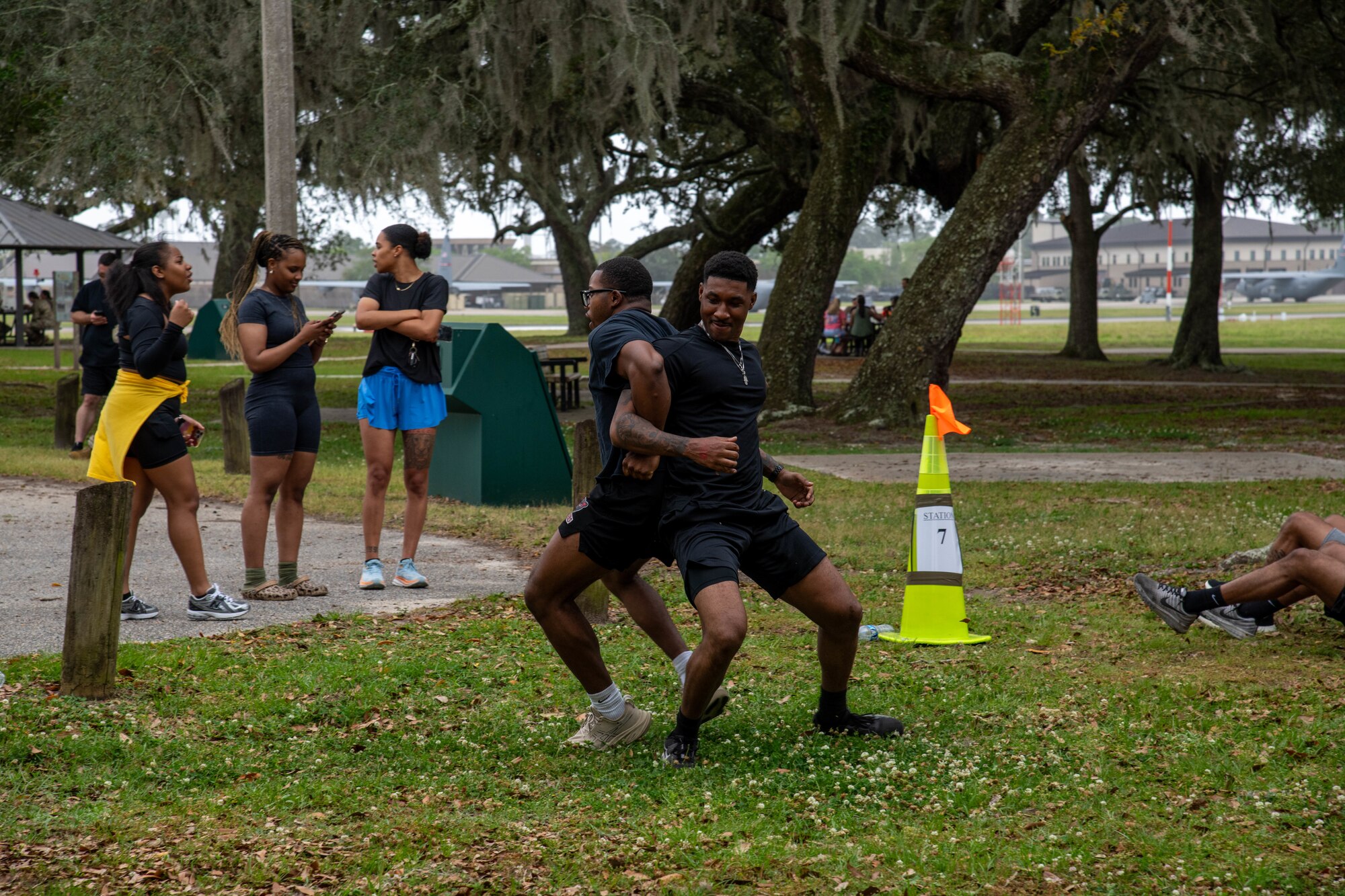 Airmen participating in obstacle course