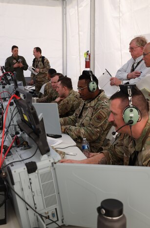 Airmen with the 752 Operations Support Squadron work through their first vulnerably window, or vul, on the Tactical Operations Center – Light during the start of Project Convergence Capstone 5, at the National Training Center, Fort Irwin, California, March 10, 2025. The vul was actively observed by members of the 46th Test Squadron, the 605th Test and Evaluations Squadron, and the Air Force Operational Test and Evaluation Center, which allows for rapid iteration and feedback loops that accelerate the development and refinement of tactics, techniques, and procedures for multi-domain operations. (Official Air Force Photo by Morgan Brown).