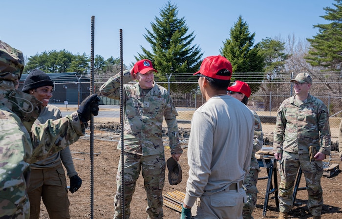 U.S. Air Force Brig. Gen. Michael Zuhlsdorf, Headquarters Pacific Air Forces director of logistics, engineering and force protection, wears a red ball cap during a site tour at Misawa Air Base, Japan, April 9, 2025.