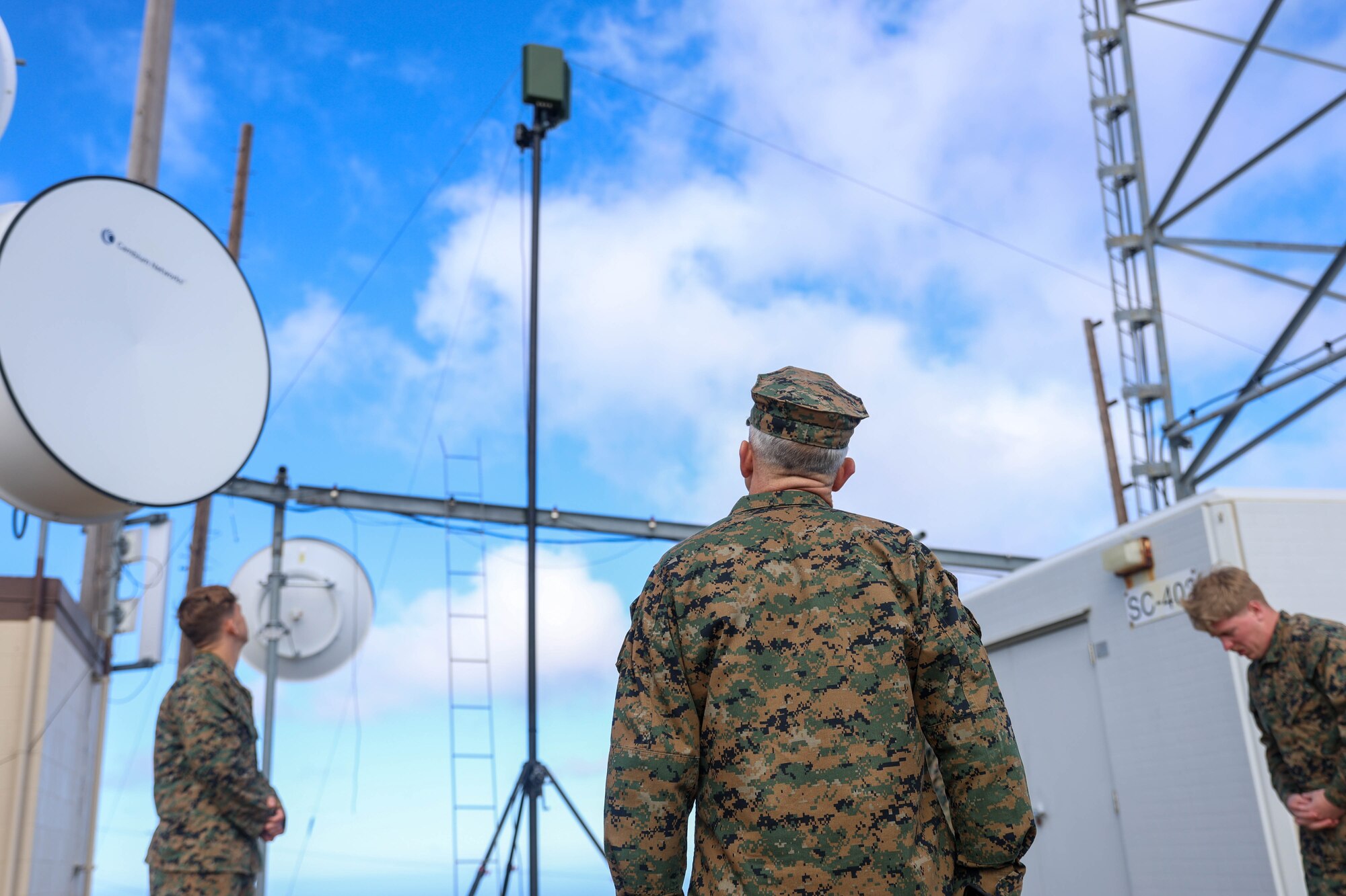 U.S. Marine Corps Maj. Gen. James B. Wellons, commanding general of 3rd Marine Aircraft Wing, observes a 360-degree communication radio used by Marines with Marine Air Control Group 38, 3rd Marine Aircraft Wing, to facilitate and track data flow during Project Convergence Capstone 5 (PC-C5) on San Clemente Island, California, March 7, 2025. PC-C5 showcases multi-domain concepts, demonstrates advanced future capabilities and tests future concepts for the Army, joint services, and multinational allies and partners. (U.S. Marine Corps photo by Cpl. Michael Bartman)