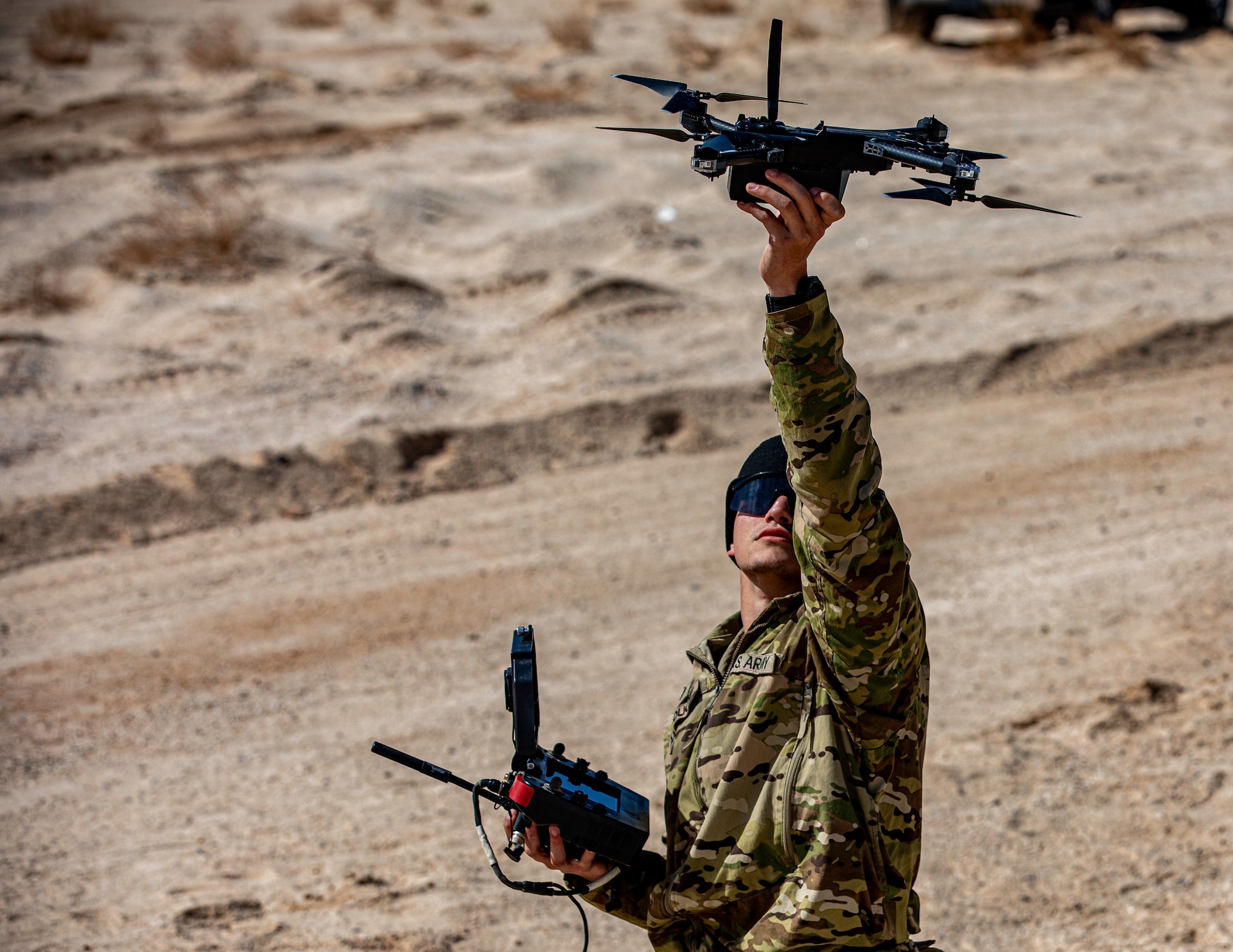 A Soldier holds a drone.
