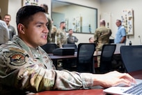 Tech. Sgt. Erik Garduno, 318th Training Squadron, operates the simulator in the Aircraft Maintenance Officer Course lab. The squadron recently acquired new and upgraded software and equipment that leaders say significantly improves its functionality and accuracy. The acquisition was a result of a collaborative effort between the Inter-American Air Forces Academy and the Air Mobility Command which enabled the Expeditionary Operations School to share its resources. (U.S. Air Force photo by Vanessa R. Adame)