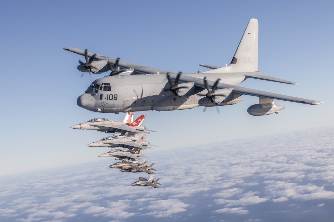 U.S. Marines and aircraft with Marine Aircraft Group 11, 3rd Marine Aircraft Wing, conduct a formation flight as part of Project Legacy off the coast of San Diego, March 4, 2025. The Project Legacy flight was a unique opportunity for all aircraft platforms across MAG-11 to fly as one team, practice tight formations, and take part in the documentation of a historical flight. (U.S. Marine Corps photo by Lance Cpl. Jennifer Sanchez)