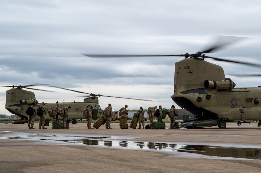 Airmen from the 175th Mission Support Group, Maryland Air National Guard, board a 29th Combat Aviation Brigade CH-47 Chinook at Martin State Air National Guard Base, Middle River, Maryland, to participate in Exercise Wolverine Strike, April 4, 2025.