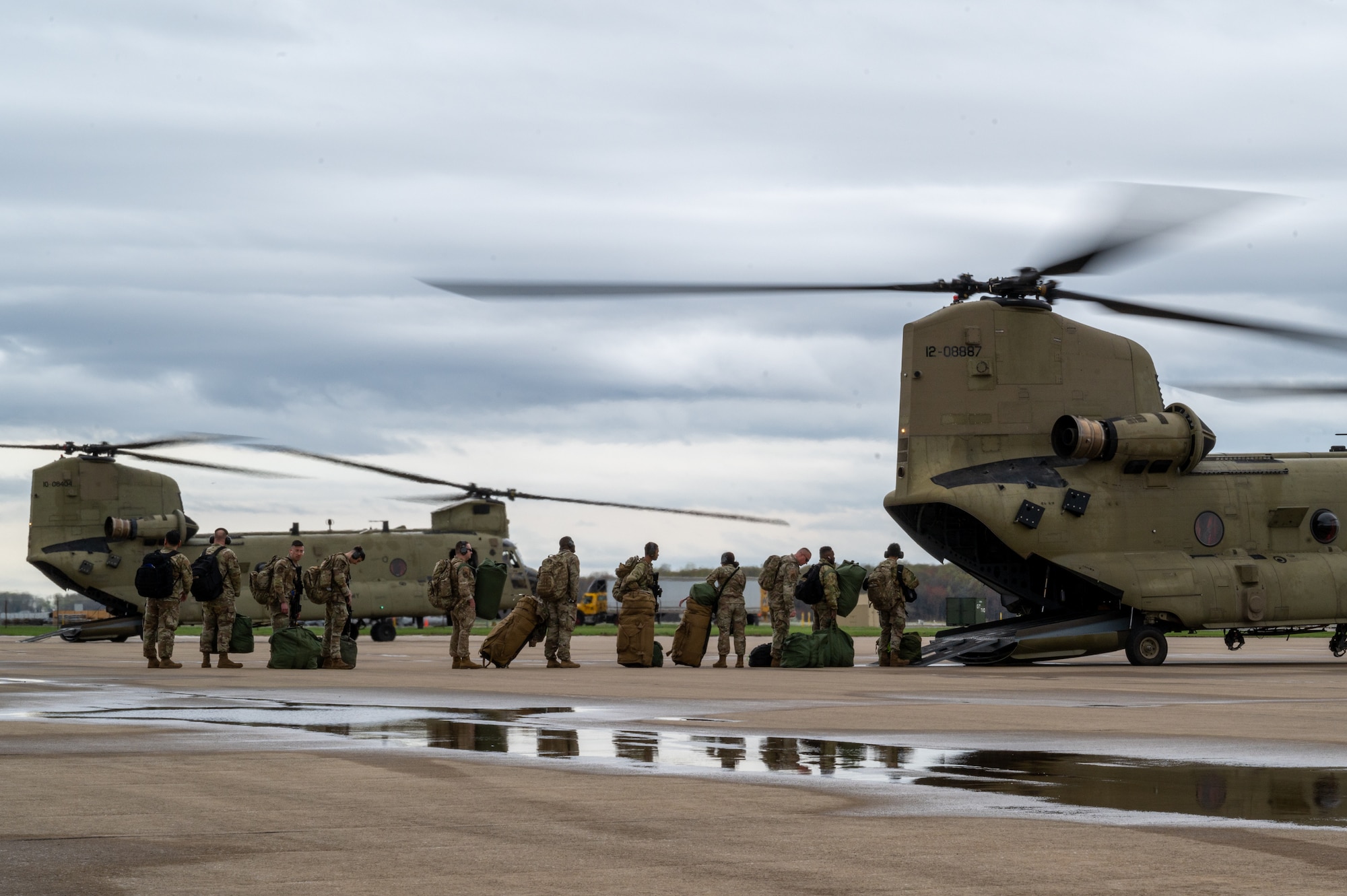 Airmen from the 175th Mission Support Group, Maryland Air National Guard, board a 29th Combat Aviation Brigade CH-47 Chinook at Martin State Air National Guard Base, Middle River, Maryland, to participate in Exercise Wolverine Strike, April 4, 2025.