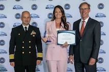 (center) Whitney Gillman, NSWC PCD Human Resource specialist, was awarded with the FY24 NSWC PCD Business Excellence Award, March 27, 2025. Her promotion of a culture of excellence and impact in customer satisfaction has positioned the command for success. (U.S. Navy photo by Eddie Green)