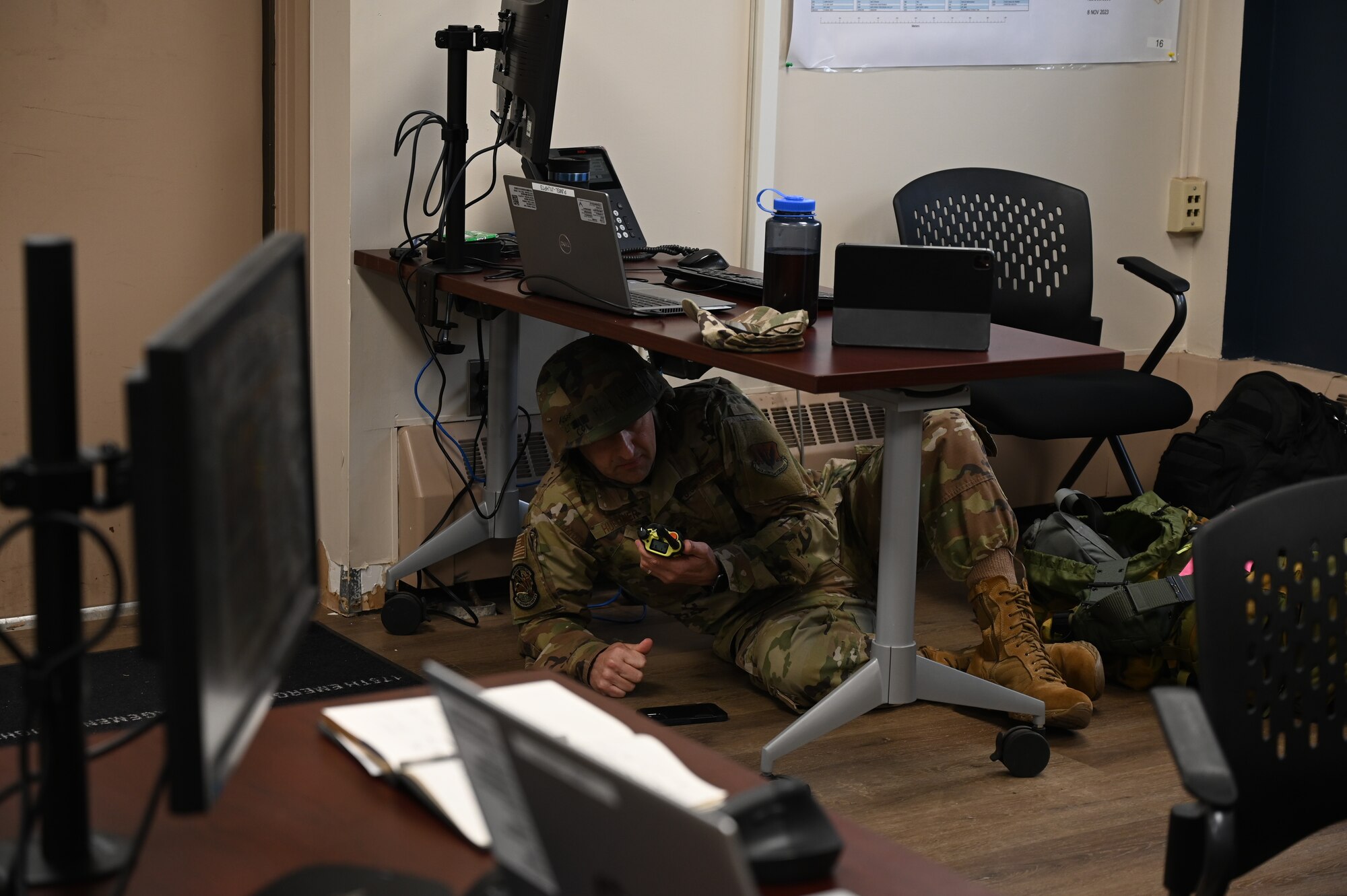Maryland Air National Guard Lt. Col. Paul Huettner, commander of the 175th communications squadron, calls in a simulated attack over the radio from the emergency operations center at Martin State Air National Guard Base, Middle River, Maryland, April 5, 2025.