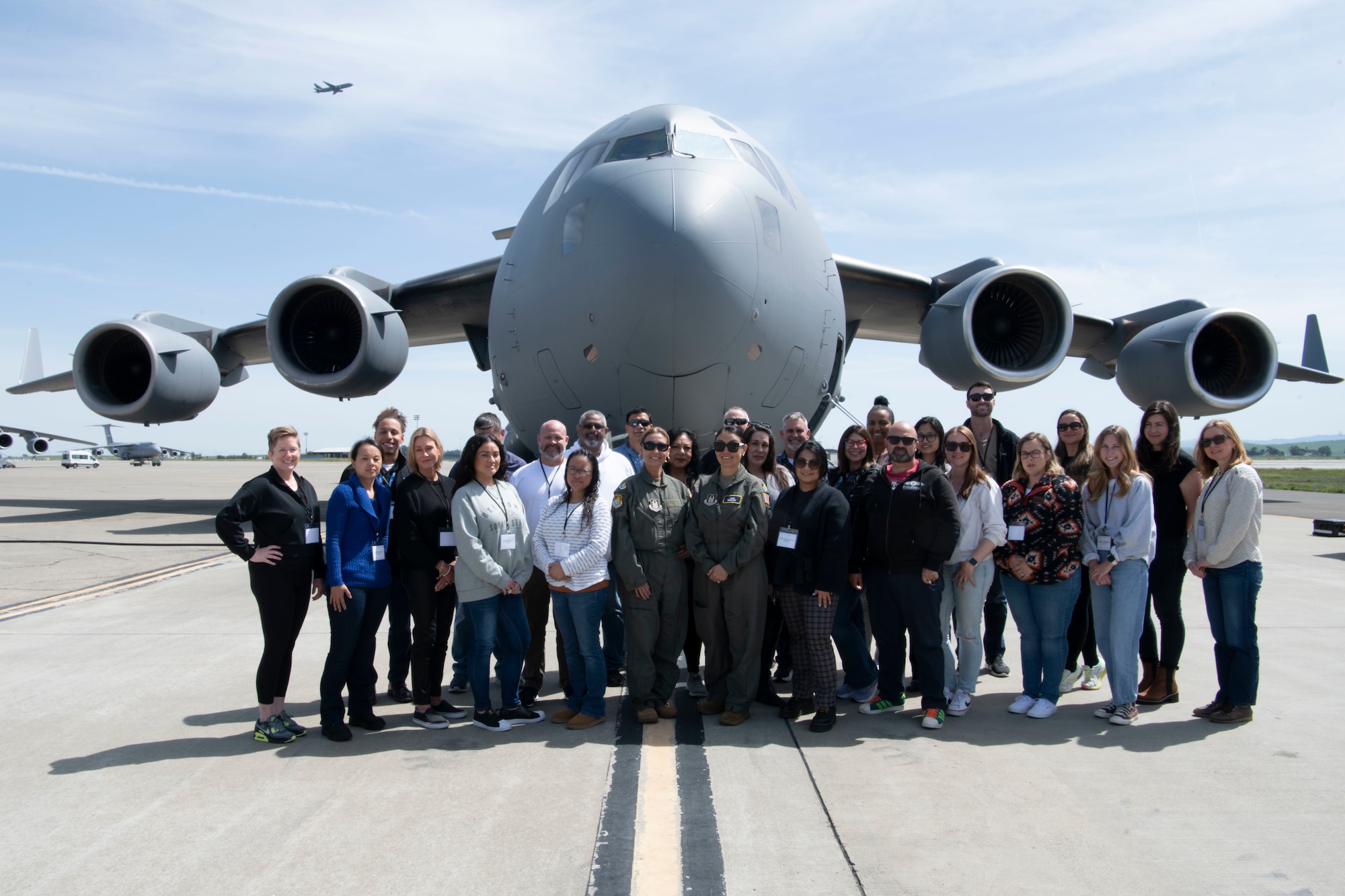 Members standing in front of the C-17 posing for a picture.